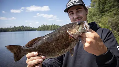 Trip Planning Man holding fish