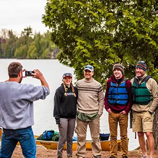 man taking photo of canoe group before bwca trip poplar lake rockwood